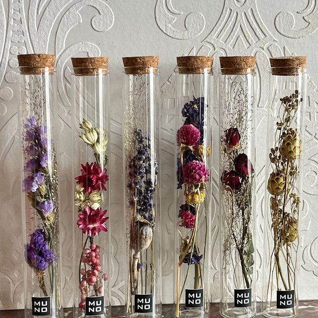 Glass tubes filled with a beautiful arrangement of dried flowers – a stylish and lasting decoration to brighten up any